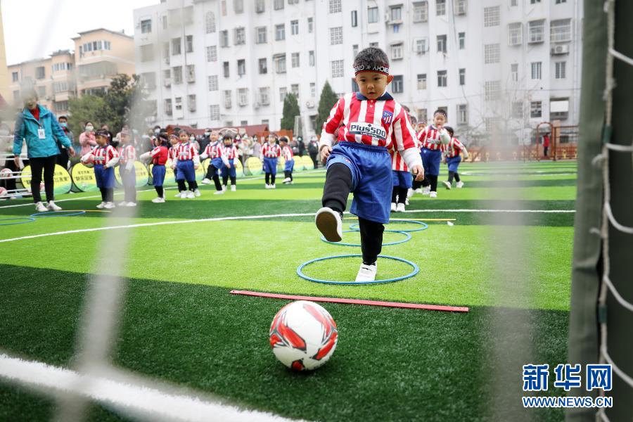 Children play football at kindergarten in Anhui