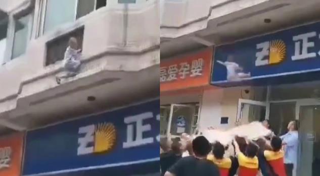 2岁男孩坠楼瞬间，市民托举窗帘救援