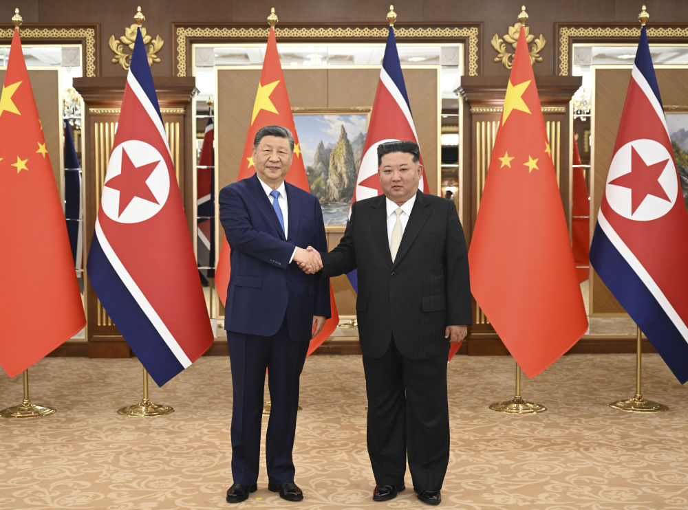 习近平同金正恩举行会谈 习近平同金正恩举行会谈