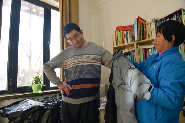 北京:轮椅上的清华博士 北京:轮椅上的清华博士