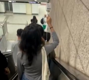 全网关注！上海深夜举吊瓶赶地铁女生称不想浪费钱打车：行为不妥勿模仿
