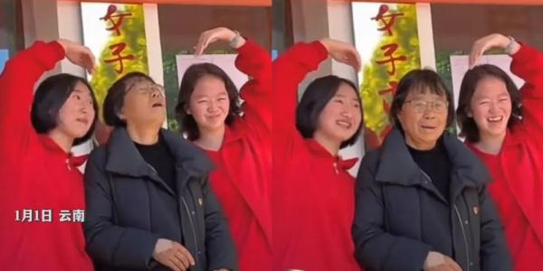 比心比耶都配合！新年合影，张桂梅和孩子们笑得一样甜……