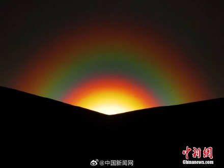 梦幻感十足！额尔古纳现落日彩虹