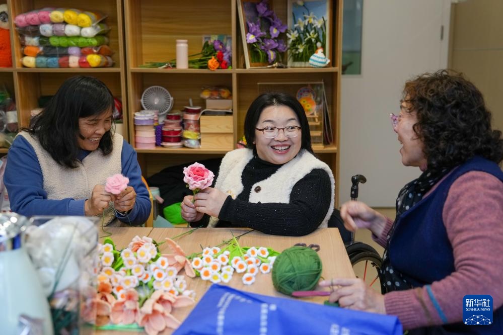 轮椅上的助残之光