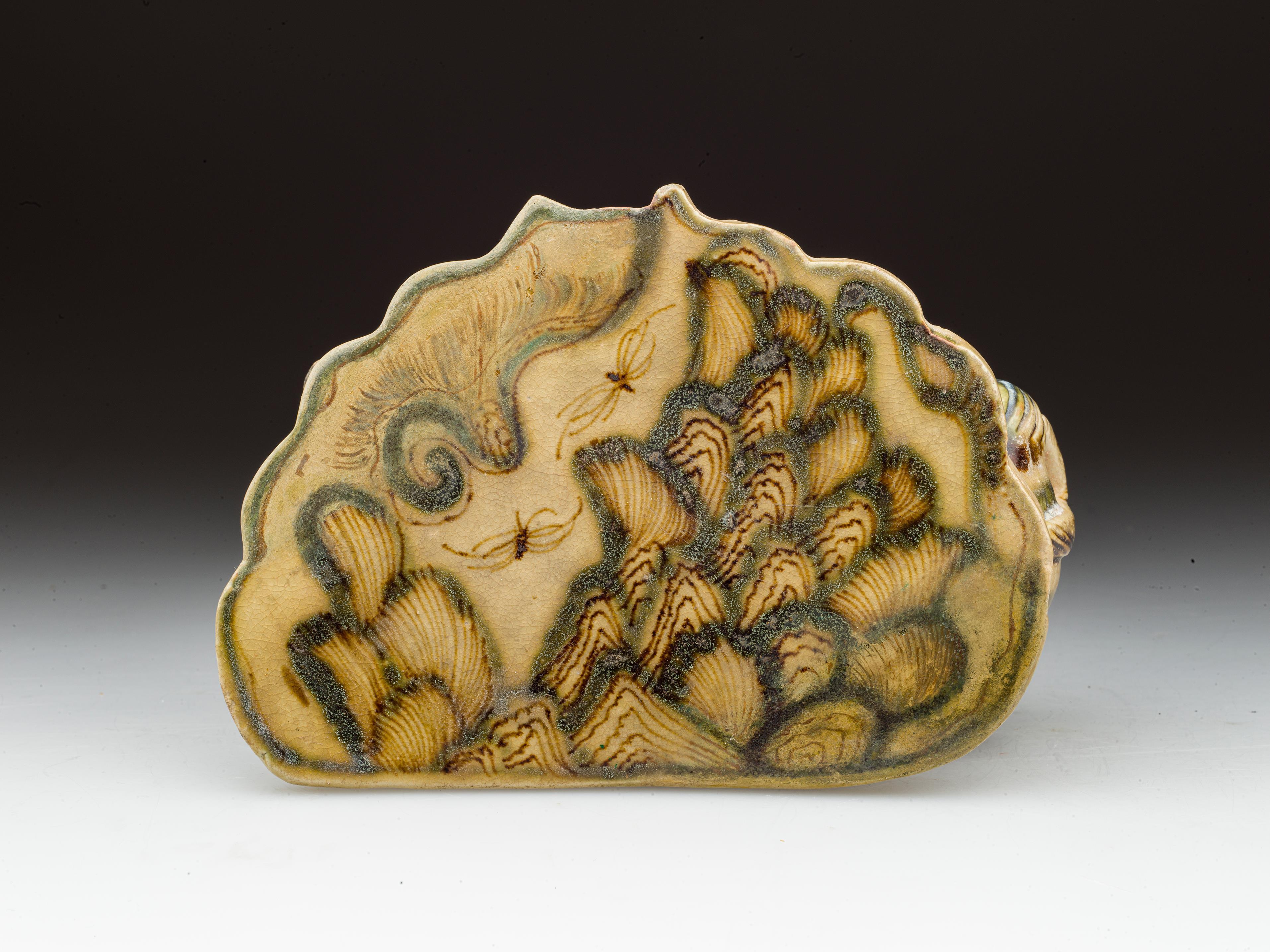 古人的“硬”核瓷枕 由一只小兽来守护