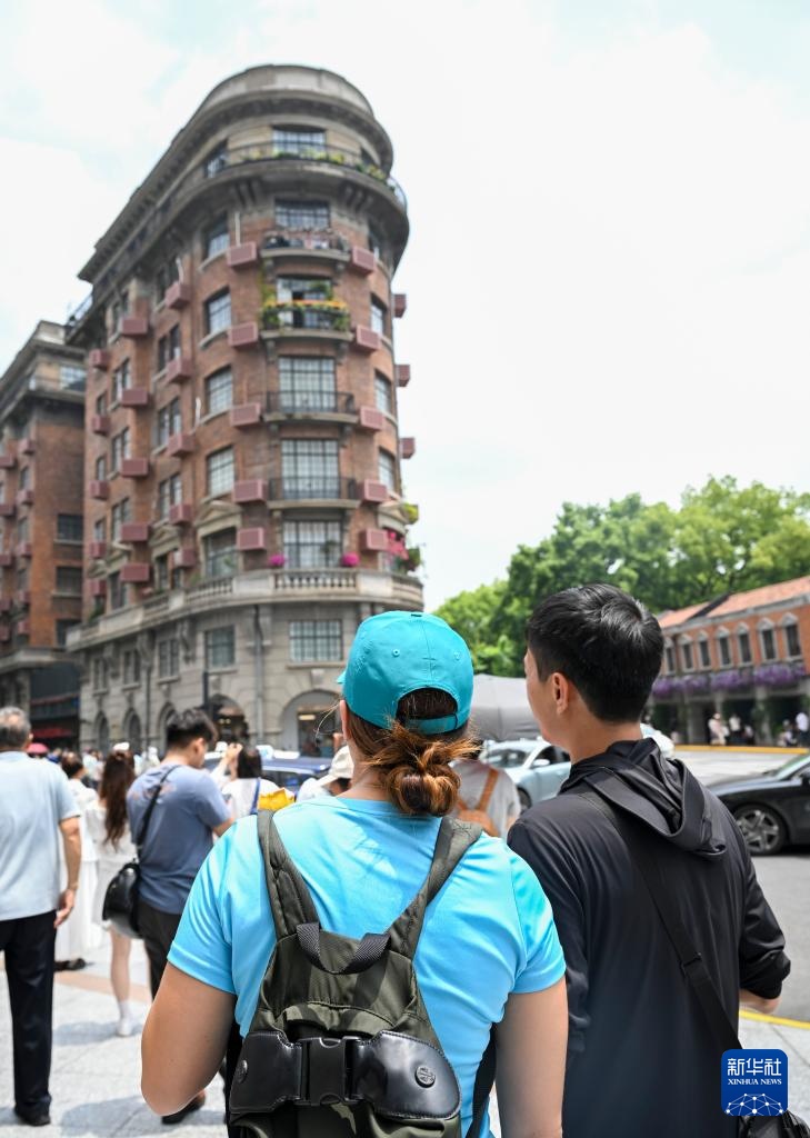 图片故事丨入境旅游策划师刘礼超：用骑行游向世界讲述“上海故事”